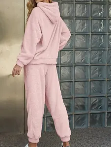 Back view of a cozy pink fuzzy hoodie and pants two-piece lounge set for women