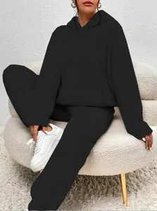 Detailed view of women's black fuzzy sherpa hoodie and matching lounge pants set