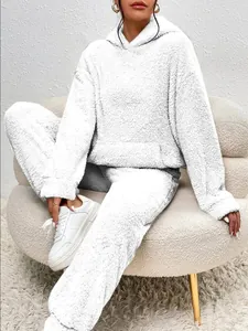 Close-up detail of white fuzzy fleece loungewear set with hoodie and relaxed pants