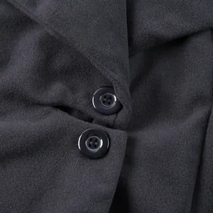 Macro view of high-quality double-sided wool fabric and black buttons on a women's coat