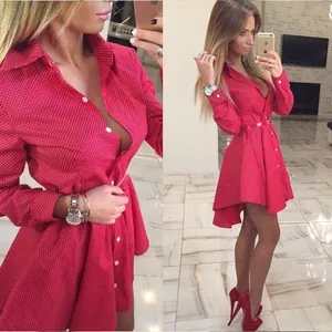Stylish red polka dot high-low shirt dress featuring a swallowtail hem and long sleeves
