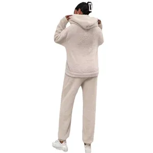 Cozy two-piece sherpa fleece loungewear set featuring a hoodie and matching pants