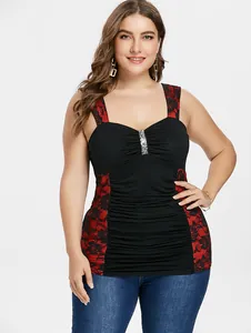 Detail view of a sexy black camisole top with red floral lace panels and sequins.