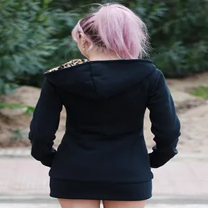 Detailed back view of a black hooded sweatshirt with stylish leopard print hood lining