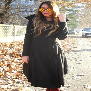 Full view of women's black double-faced wool coat with a stylish irregular hem.