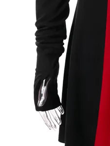 Close-up of sleeve detail with thumb hole on black and red hooded jacket