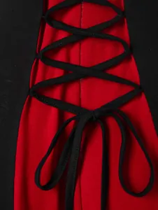 Close-up detail of a black and red color block jacket with back lace-up cord design.