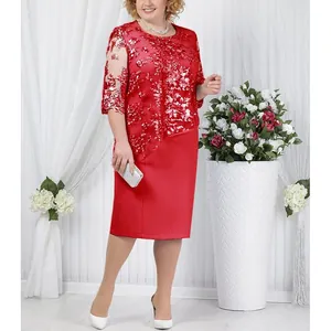 Detail view showing the elegant red plus size dress with intricate floral lace overlay
