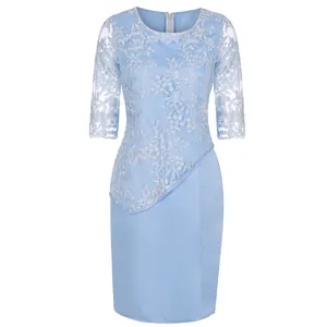 Detail view of light blue lace patchwork knee-length cocktail dress with floral embroidery.
