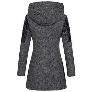 Back view of women's grey hooded coat with quilted black shoulder patches.