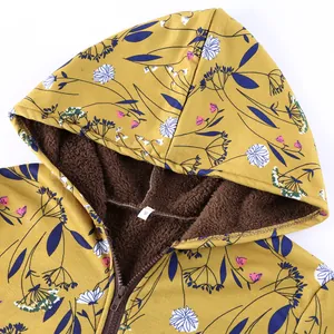 Close-up of floral print hooded jacket showing thick brown fleece lining and zipper