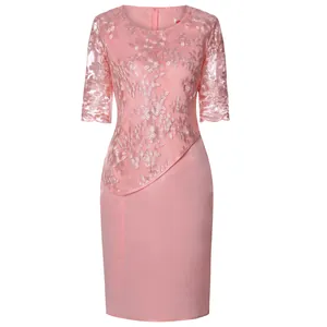Detailed view of pink lace patchwork dress featuring elegant floral embroidery and mesh sleeves