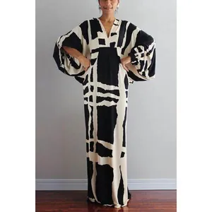 Detailed view of vintage loose V-neck maxi dress with bold black and white geometric print