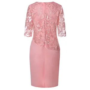 Rear view of a pink lace patchwork dress showing embroidery details and silhouette.
