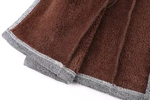 Macro view of the soft brown plush interior lining and grey melange wool blend fabric