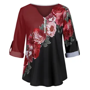 Elegant floral print V-neck blouse featuring a red and black patchwork design and 3/4 sleeves.