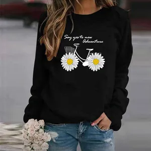 Black long sleeve sweatshirt featuring daisy bicycle print and adventure text detail