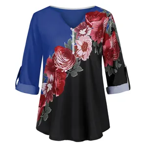 Detail of women's vintage floral print V-neck blouse with blue and black color block
