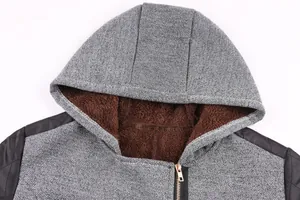 Close-up of winter hooded coat showing warm brown fleece lining and grey outer texture.