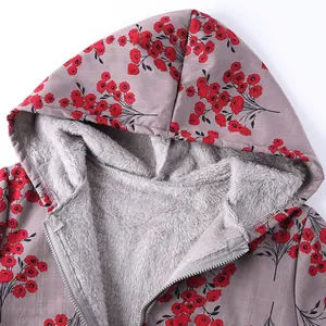 Close-up of floral print hooded jacket with warm fleece lining and silver front zipper detail