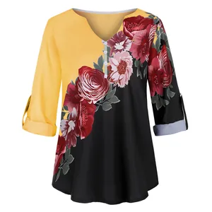 Detailed view of women's V-neck floral print blouse with stylish 3/4 rolled sleeves