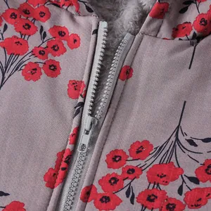 Close-up detail showing the floral print and warm fuzzy fleece lining of the women's jacket