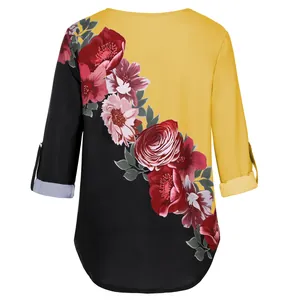 Back view of women's vintage floral print blouse with yellow and black patchwork design