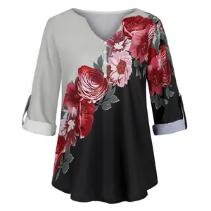 Detailed view of women's vintage floral print V-neck shirt with elegant color block design