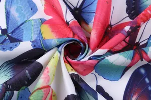 Close-up detail of vibrant ink painting butterfly print fabric with soft draped texture