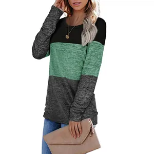 Detailed view of women's crewneck color-block sweatshirt with green and grey panels