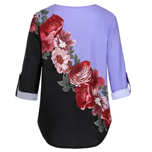 Vintage women's floral print shirt featuring purple and black color block design
