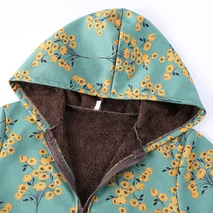 Close-up of floral hooded jacket for women featuring warm brown plush fleece lining.