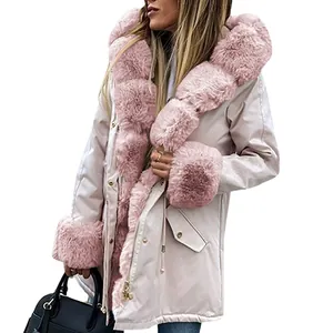 Detail of pink faux fur collar on women's warm winter hooded parka coat