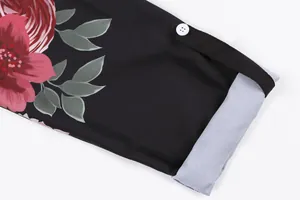 Detail shot of vintage floral print shirt sleeve featuring white button and grey lining