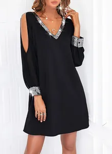 Elegant black V-neck cold shoulder mini dress with shiny silver sequin trim and cuffs