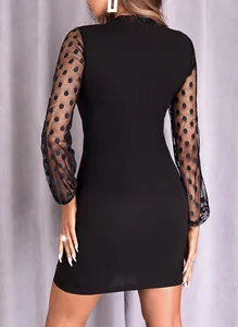 Back view of a black bodycon mini dress featuring elegant polka dot sheer mesh sleeves.