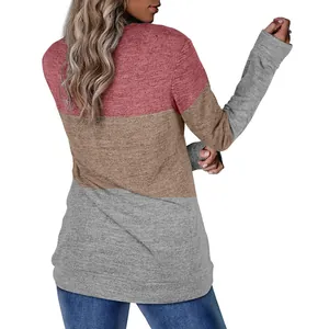 Back view of women's color-block crewneck sweatshirt in pink, tan, and grey marl