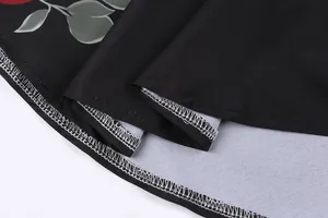 Macro view of professional stitching and hem details on vintage floral print shirt