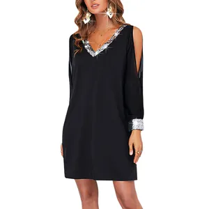 Detailed view of casual black cold-shoulder mini dress featuring sparkling sequin V-neck trim