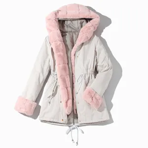 Detail view of women's warm hooded winter coat with soft pink plush faux fur trim