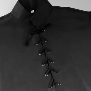 Detailed view of the lacing system and collar on a black medieval-style performance top.