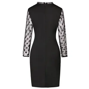 Detail view of black bodycon dress with polka dot mesh sleeves and lace trim collar