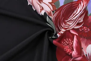 Detailed macro view of high-quality red and pink floral print fabric for vintage women's shirts