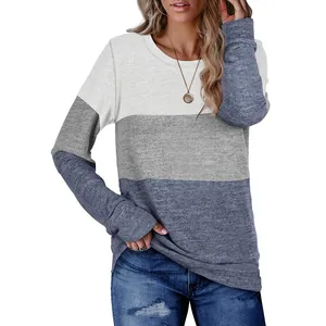 Close-up of women's color-blocked round neck pullover sweatshirt with marled texture