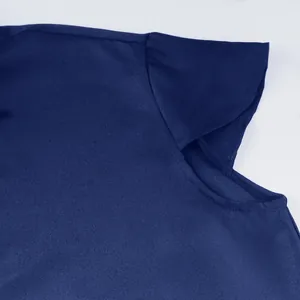 Detailed macro view of navy blue medieval tunic sleeve with petal design and texture