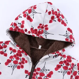 Close-up detail of women's floral hooded jacket featuring a warm plush brown fleece lining