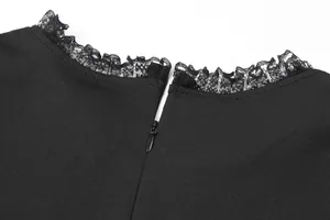 Close-up detail of delicate lace-trimmed neckline and concealed back zipper on black dress