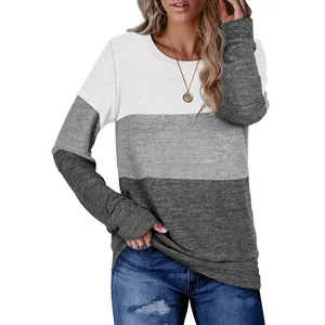 Front view of women's round neck long sleeve sweatshirt with three-color block design.