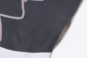 Macro view showing the side pocket detail and neat stitching on a vintage printed summer dress