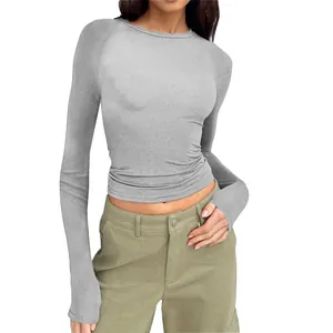 Slim fit grey long sleeve T-shirt for women featuring round neck and raglan sleeves design.